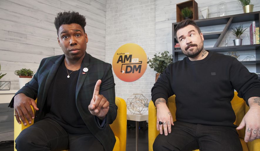 This image released by Buzzfeed shows Saeed Jones, left, and Isaac Fitzgerald, cohosts of BuzzFeed News AM to DM. Launched quietly in late September from a studio in BuzzFeed's Manhattan office, "AM to DM" is a breezy mix of news and pop culture. Viewers can click on Twitter and watch the stream live, or catch highlights later in the day. (Drew Reynolds/Buzzfeed via AP)