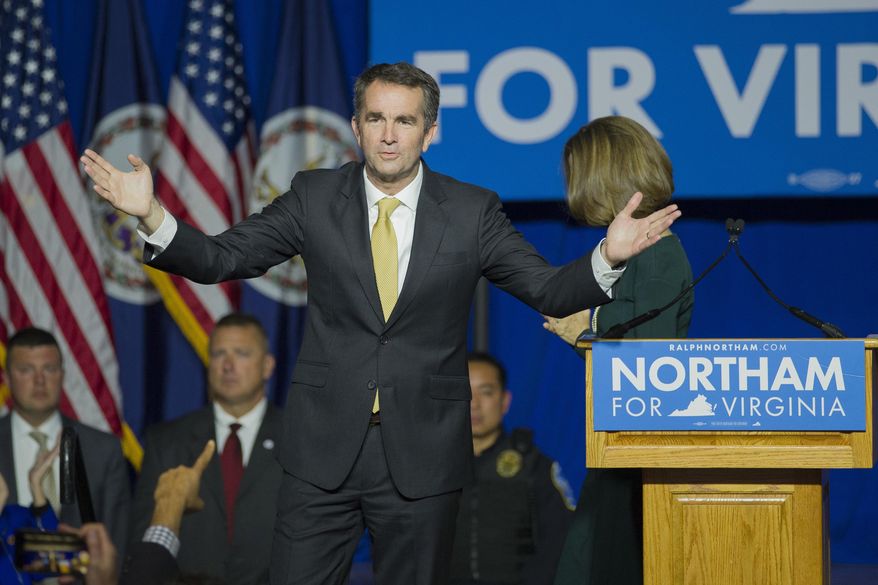 FILE - In this Tuesday Nov. 7, 2017 file photo, Virginia Gov.-elect Ralph Northam celebrates his election victory and addresses supporters and at the Northam For Governor election night party at George Mason University in Fairfax, Va. The Democrats’ big wins in Virginia’s elections last week weren’t enough to gain control of the House of Delegates, and some say gerrymandering is to blame.  (AP Photo/Cliff Owen, File)