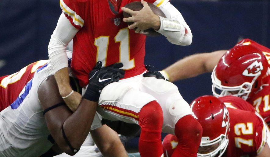 FILE - In this Sunday, Nov. 5, 2017, file photo, Dallas Cowboys defensive tackle David Irving, left, sacks Kansas City Chiefs quarterback Alex Smith (11) in the second half of an NFL football game in Arlington, Texas. The Chiefs hope a week off can serve as a reset to their season. They began 5-0 before losing three of their last four, and quarterback Alex Smith even threw an interception in a loss to Dallas just before the bye. (AP Photo/Michael Ainsworth, File)
