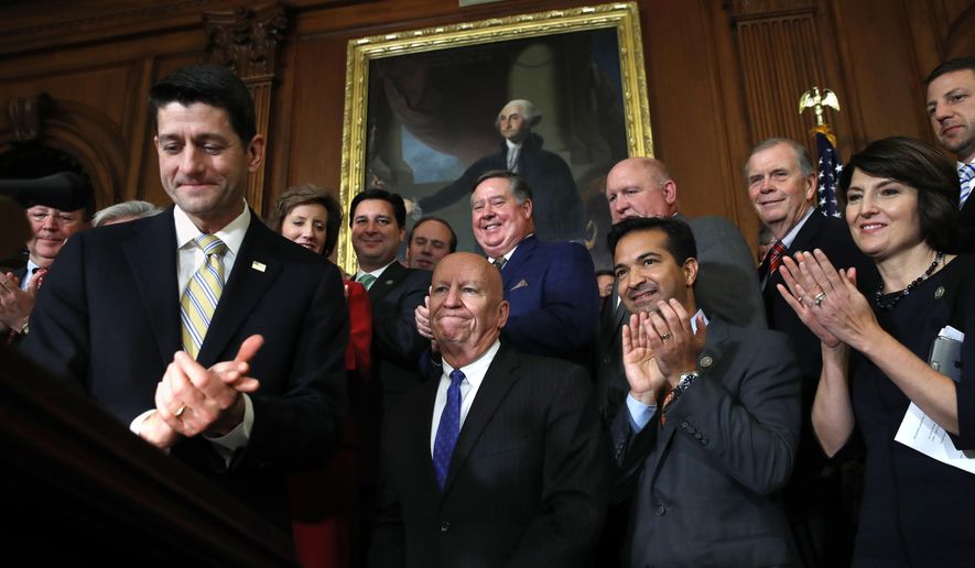 House Speaker Paul Ryan of Wis., left, leads applause for House Ways and Means Chair Rep. Kevin Brady, R-Texas, along with Rep. Carlos Curbelo, R-Fla., and Rep. Cathy McMorris Rodgers, R-Wash., during a news conference following a vote on tax reform on Capitol Hill in Washington, Thursday, Nov. 16, 2017. Republicans passed a near $1.5 trillion package overhauling corporate and personal taxes through the House, edging President Donald Trump and the GOP toward their first big legislative triumph in a year in which they and their voters expected much more. (AP Photo/Jacquelyn Martin)