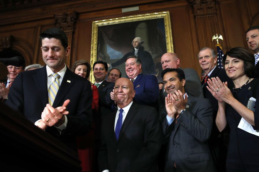 House Speaker Paul Ryan of Wis., left, leads applause for House Ways and Means Chair Rep. Kevin Brady, R-Texas, along with Rep. Carlos Curbelo, R-Fla., and Rep. Cathy McMorris Rodgers, R-Wash., during a news conference following a vote on tax reform on Capitol Hill in Washington, Thursday, Nov. 16, 2017. Republicans passed a near $1.5 trillion package overhauling corporate and personal taxes through the House, edging President Donald Trump and the GOP toward their first big legislative triumph in a year in which they and their voters expected much more. (AP Photo/Jacquelyn Martin)