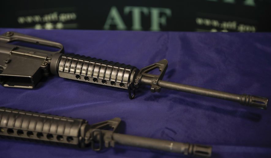 In this Tuesday, Aug. 29, 2017, photo, homemade rifles are displayed on a table at an ATF field office in Glendale, Calif. Police say Kevin Neal, who was barred from having guns because of a restraining order, made the two high-powered rifles he used in his shooting rampage in Northern California on Tuesday, Nov. 14. (AP Photo/Jae C. Hong)