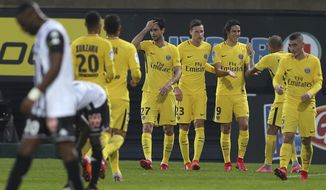 Paris Saint Germain&#x27;s forward Edinson Cavani of Uruguay, third right, celebrates with teammates after scoring the second goal during his French League One soccer match against Angers, Saturday, Nov. 4, 2017, in Angers, western France. (AP Photo/David Vincent)