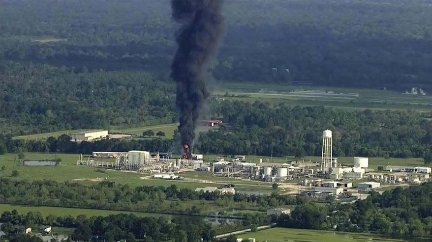 FILE - In this Sept. 1, 2017, file photo, smoke rises from the Arkema Inc. owned chemical plant in Crosby, near Houston, Texas. The county that's home to Houston has asked a state court to order safeguards and fine the owner of a chemical plant that partially exploded during Hurricane Harvey. In a lawsuit filed Thursday, Nov. 16, 2017, the Harris County Attorney's Office said Arkema Inc.'s facility in Crosby violated Texas environmental laws by releasing toxic and hazardous chemicals during flooding and fires, sickening first responders and residents. (KTRK via AP, File)