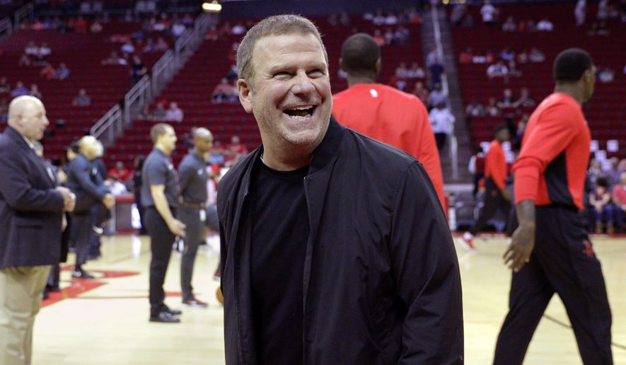 In this Oct. 13, 2017, file photo, new Houston Rockets owner Tilman Fertitta reacts before an NBA preseason basketball game against the San Antonio Spurs in Houston. Fertitta is interested in bringing an NHL hockey team to Houston, a possibility that did not exist under the NBA team’s previous regime. (AP Photo/Michael Wyke, File) **FILE**