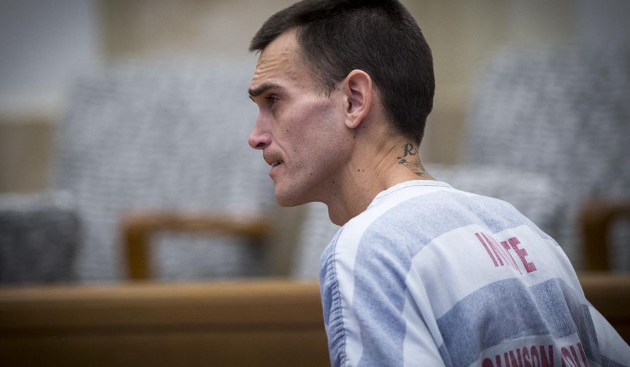 FILE - In this Nov. 2, 2017 file photo, Justin Rey appears in Johnson County District Court in Olathe, Kan. Preliminary autopsy results confirm that dismembered human remains found inside a suburban Kansas City storage unit were those of woman whose husband was sleeping in the unit with their 4-day-old baby and 2-year-old child. The arrest affidavit for Rey was released Tuesday, Nov. 14, 2017. He's jailed on $1 million bond in Johnson County, Kan., on child endangerment charges. He's not been charged in his wife's death. (Tammy Ljungblad/The Kansas City Star via AP, Pool File)