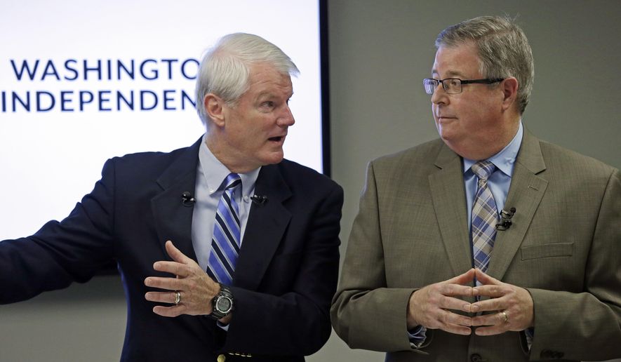 Former Democratic Congressman, Brian Baird, left, and former Republican State Representative Chris Vance speak at a news conference Thursday, Nov. 16, 2017, in Seattle. They announced the launch of a new effort to promote independent, centrist-minded politicians in Washington state. The move is part of a national movement to curb partisanship. (AP Photo/Elaine Thompson)