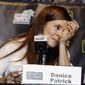 Danica Patrick wipes away tears as he speaks with the media during a news conference before Sunday&#39;s NASCAR Cup Series auto race at Homestead-Miami Speedway in Homestead, Fla., Friday, Nov. 17, 2017. Patrick will end her full-time racing career after running in next year&#39;s Daytona 500 and Indianapolis 500. ( AP Photo/Darryl Graham)
