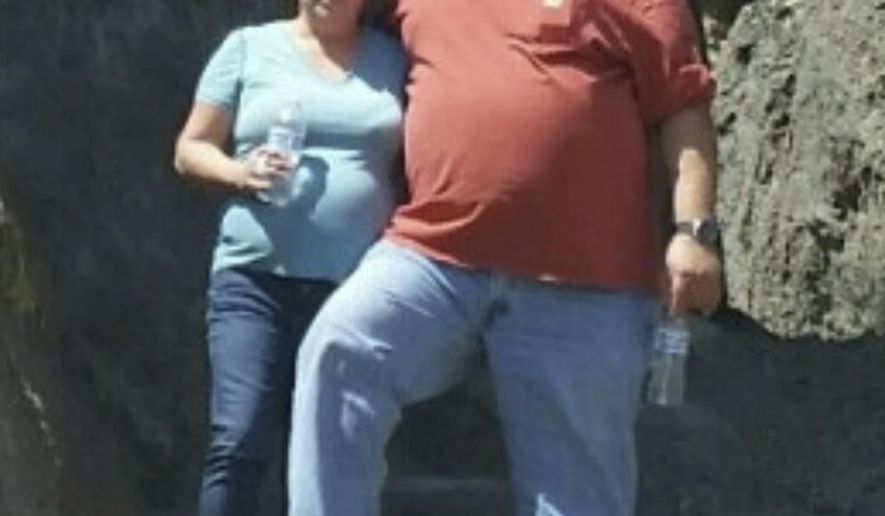 In this Aug. 20, 2017, photo provided by Rhonda McFadyen, Michelle and Troy McFadyen pose for a photo in Little City of Rocks, Idaho. Michelle was driving to the store with her husband, Troy, when the couple strayed into the path of a shooting rampage in their small Northern California town on Tuesday, Nov. 14. The gunman, identified by authorities as Kevin Neal, killed Michelle and wounded her husband, Troy, people he randomly picked to shoot after killing his wife and two of neighbors. (Rhonda McFadyen via AP)