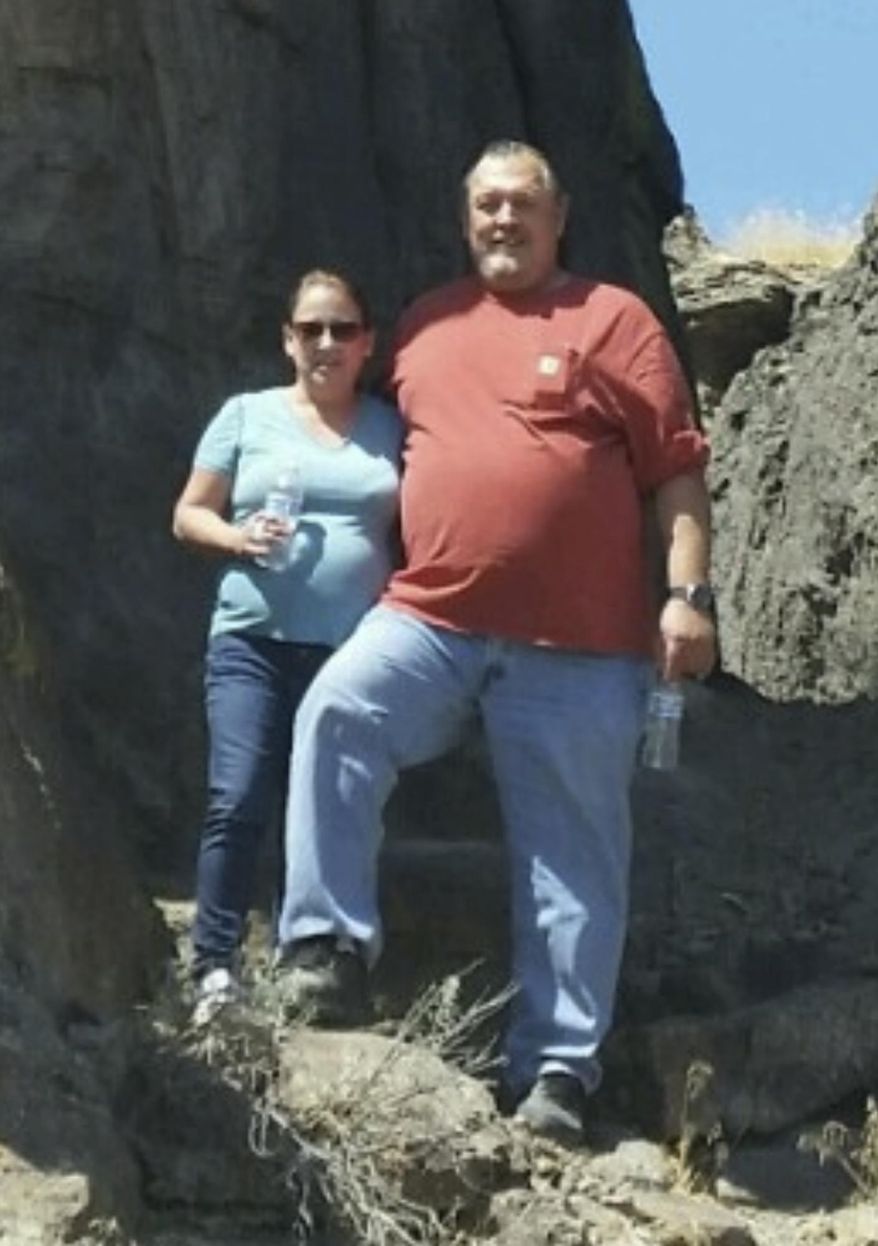 In this Aug. 20, 2017, photo provided by Rhonda McFadyen, Michelle and Troy McFadyen pose for a photo in Little City of Rocks, Idaho. Michelle was driving to the store with her husband, Troy, when the couple strayed into the path of a shooting rampage in their small Northern California town on Tuesday, Nov. 14. The gunman, identified by authorities as Kevin Neal, killed Michelle and wounded her husband, Troy, people he randomly picked to shoot after killing his wife and two of neighbors. (Rhonda McFadyen via AP)
