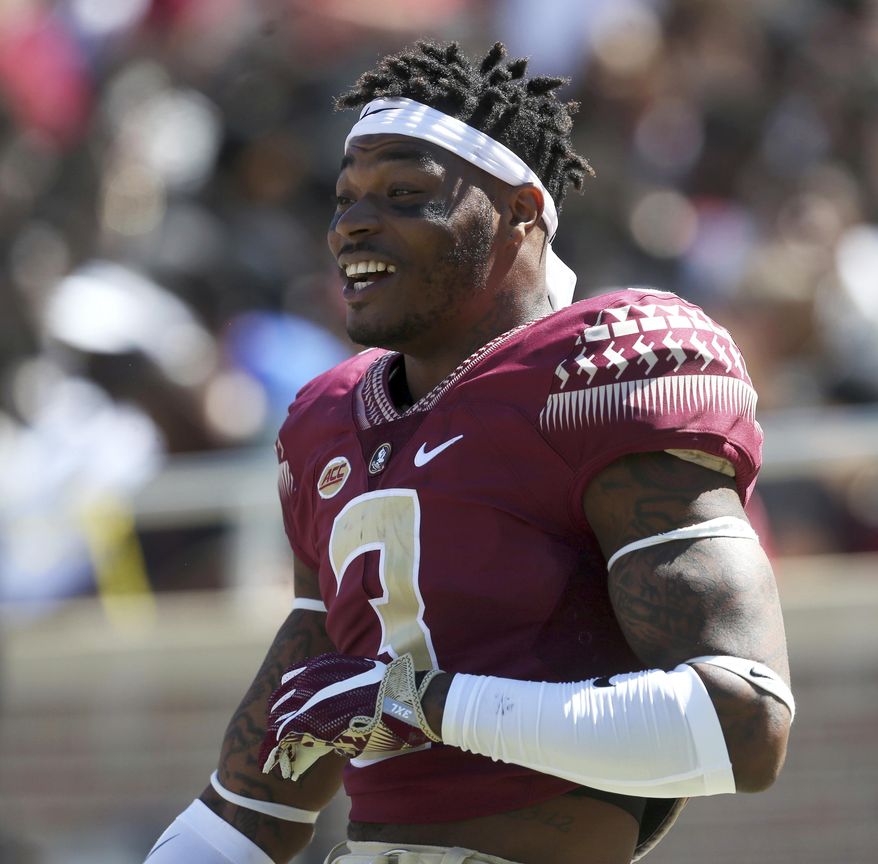 FILE - Ink this April 8, 2017 file photo, Florida State's Derwin James smiles from the sideline during the NCAA college football team's Garnet and Gold spring game in Tallahassee, Fla. Florida State, which needs to win its final three games in order to be bowl eligible, is heavily favored to beat Delaware State on Saturday, Nov. 18.(Joe Rondone/Tallahassee Democrat via AP, File)