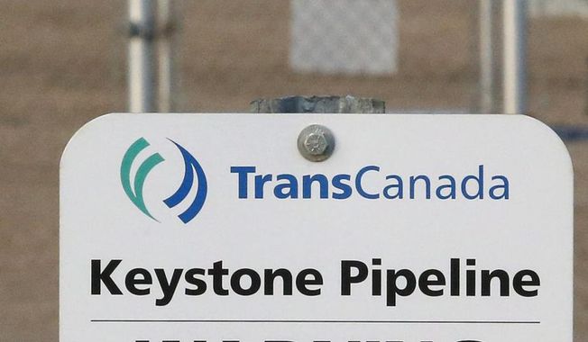 This Nov. 6, 2015, file photo shows a sign for TransCanada&#x27;s Keystone pipeline facilities in Hardisty, Alberta, Canada. TransCanada Corp.’s Keystone pipeline leaked oil onto agricultural land in northeastern South Dakota, the company and state regulators said Thursday, Nov. 16, 2017, but state officials don’t believe the leak polluted any surface water bodies or drinking water systems. (Jeff McIntosh/The Canadian Press via AP, File)