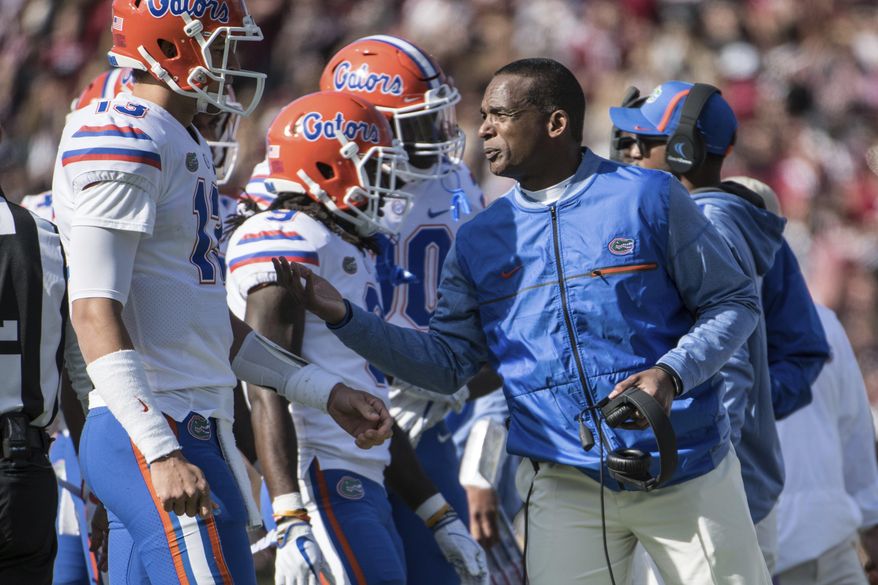 FILE - In this Nov. 11, 2017 file photo, Florida head coach Randy Shannon talks with quarterback Feleipe Franks (13) during the first half of an NCAA college football game in Columbia, S.C. Florida has little left to play for this season. Championship dreams are long gone. Bowl hopes are squashed. Even a .500 season is out the window. So what’s left? The Gators (3-6) are playing for pride. They have two games remaining at home to at least end a miserable season on a positive note. It begins against bowl-eligible UAB (7-3) on Saturday, Nov. 18.(AP Photo/Sean Rayford, File)