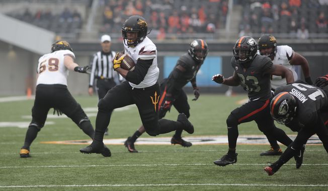 Arizona State running back Demario Richard breaks through the Oregon State defense for a touchdown in the first half of an NCAA college football game, in Corvallis, Ore., Saturday, Nov. 18, 2017. (AP Photo/Timothy J. Gonzalez)