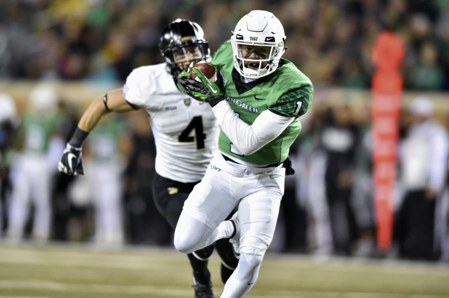 North Texas wide receiver Turner Smiley (1) catches a pass and scores a touchdown against the Army defense during an NCAA college football game Saturday, Nov. 18, 2017, in Denton, Texas. (Jeff Woo/The Denton Record-Chronicle via AP)