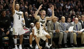 Purdue&#39;s Carsen Edwards, left, Vince Edwards, center, and Isaac Haas reacts to a teammate scoring in the second half of an NCAA college basketball game against Fairfield in West Lafayette, Ind., Saturday, Nov. 18, 2017. Purdue won 106-64. (AP Photo/AJ Mast)