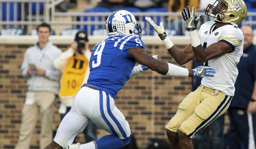 Georgia Tech's Qua Searcy, right, catches a touchdown pass ahead of Duke's Jeremy McDuffie during the first half of an NCAA college football game in Durham, N.C., Saturday, Nov. 18, 2017. (AP Photo/Ben McKeown)