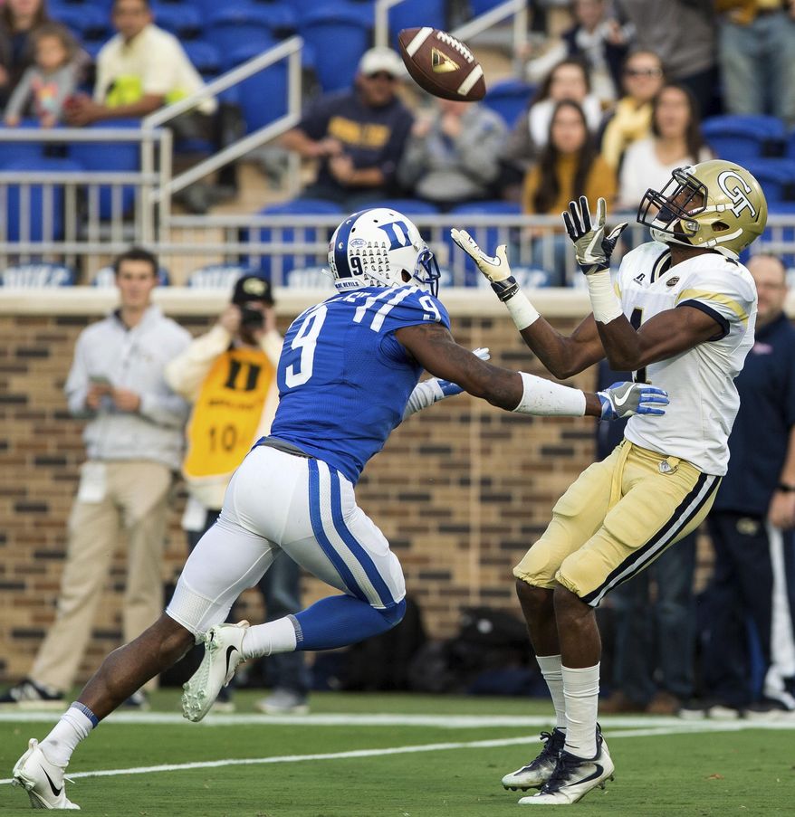Georgia Tech's Qua Searcy, right, catches a touchdown pass ahead of Duke's Jeremy McDuffie during the first half of an NCAA college football game in Durham, N.C., Saturday, Nov. 18, 2017. (AP Photo/Ben McKeown)