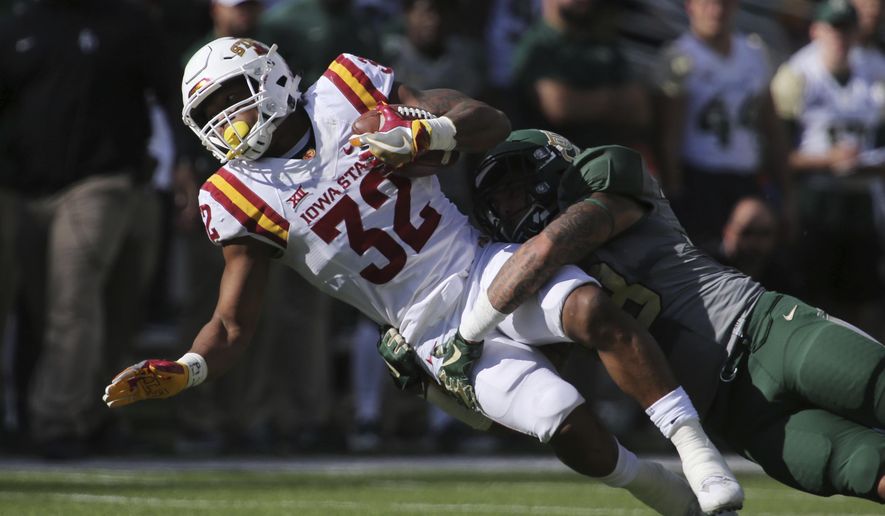 Iowa State running back David Montgomery, left, is pulled down by Baylor linebacker Jordan Williams, right, in the first half of a NCAA college football game, Saturday, Nov. 18, 2017, in Waco, Texas. (Rod Aydelotte/Waco Tribune Herald, via AP)