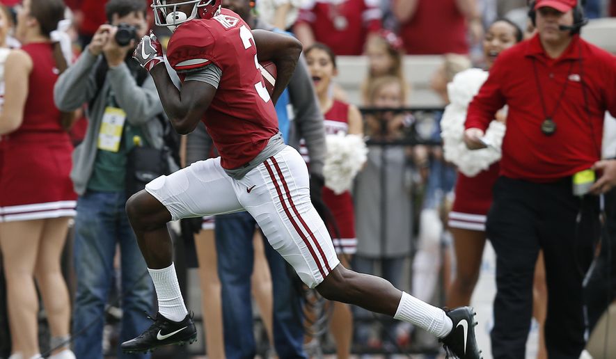 Alabama wide receiver Calvin Ridley runs in to score a touchdown against Mercer during the first half of an NCAA college football game, Saturday, Nov. 18, 2017, in Tuscaloosa, Ala. (AP Photo/Brynn Anderson)