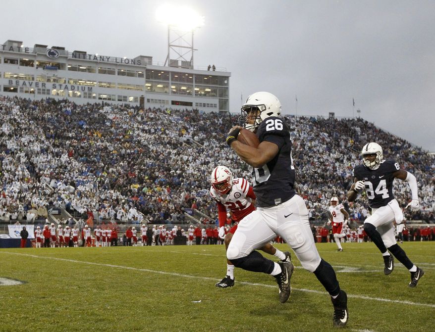 Penn State's Saquon Barkley (26) takes the ball 65 yards for a touchdown against Nebraska during the first half of an NCAA college football game in State College, Pa., Saturday, Nov. 18, 2017. (AP Photo/Chris Knight)