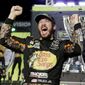 Martin Truex Jr. celebrates in Victory Lane after winning the NASCAR Cup Series auto race and season championship at Homestead-Miami Speedway in Homestead, Fla., Sunday, Nov. 19, 2017.  (AP Photo/Terry Renna)