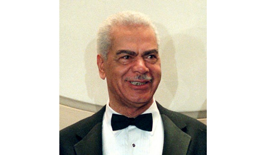 In this Feb. 3, 1997, file photo, Earle Hyman poses before an induction to the Theater Hall of Fame at the Gershwin Theatre in New York. Hyman, a veteran actor of stage and screen who was widely known for playing Russell Huxtable on "The Cosby Show," has died. Strohl, a representative for The Actors Fund, says that Hyman died Friday, Nov. 17, 2017, at the Lillian Booth Actors Home in Englewood, New Jersey. He was 91. (AP Photo/Ron Frehm, File)