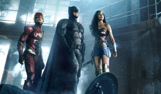 This image released by Warner Bros. Pictures shows Ezra Miller, from left, Ben Affleck and Gal Gadot in a scene from &amp;quot;Justice League.&amp;quot; (Warner Bros. Entertainment Inc. via AP)