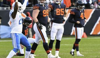 Chicago Bears kicker Connor Barth, right, bows his head as teammates Mitch Unrein and Daniel Brown watch Detroit Lions strong safety Don Carey, front left, celebrate a missed field goal with only seconds left in regulation of an NFL football game Sunday, Nov. 19, 2017, in Chicago. (John Starks/Daily Herald via AP)