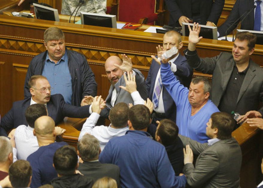 Ukrainian lawmakers scuffled during a parliament session in October. Former Georgian President Mikhail Saakashvili, who now heads an opposition party, accuses President Petro Poroshenko of stalling reforms and covering up corruption. (Associated Press/File)