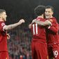 Liverpool&#39;s Mohamed Salah celebrates scoring his side&#39;s second goal of the game with team mates Liverpool&#39;s Philippe Coutinho, right, and Alberto Moreno left, during the English Premier League soccer match Liverpool versus Southampton at Anfield, Liverpool, England, Saturday Nov. 18, 2017. (Peter Byrne/PA via AP)