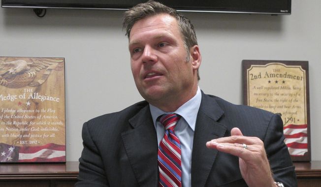 Kansas Secretary of State Kris Kobach said the panel, officially known as the Presidential Advisory Commission on Election Integrity, had gotten bogged down in legal challenges filed by Democrats, liberal groups — and even one Democratic member of the commission itself.(AP Photo/John Hanna)
