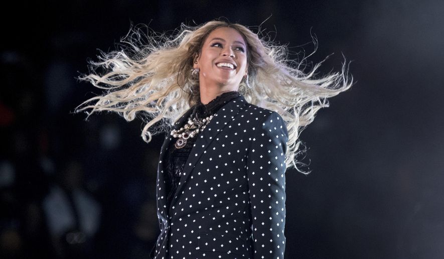 FILE - This Nov. 4, 2016, file photo shows Beyonce performing at a Get Out the Vote concert for Democratic presidential candidate Hillary Clinton in Cleveland. Forbes announced on Nov. 20, 2017, that Beyonce was the highest earning woman in the music industry. The outlet says she earned $105 million over a year-long period that ended in June. (AP Photo/Andrew Harnik, File)
