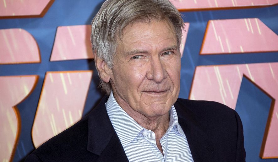 FILE - In this Sept. 21, 2017, file photo, actor Harrison Ford poses for photographers during the photo call for 'Blade Runner 2049' in London. Police tell the Ventura County, Calif. Star newspaper that Ford and others helped a woman involved in an accident on Nov. 19, 2017, out of her car before first responders arrived. (Photo by Joel Ryan/Invision/AP, File)
