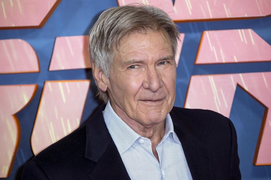 FILE - In this Sept. 21, 2017, file photo, actor Harrison Ford poses for photographers during the photo call for 'Blade Runner 2049' in London. Police tell the Ventura County, Calif. Star newspaper that Ford and others helped a woman involved in an accident on Nov. 19, 2017, out of her car before first responders arrived. (Photo by Joel Ryan/Invision/AP, File)