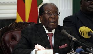 Zimbabwean President Robert Mugabe delivers his speech during a live broadcast at State House in Harare, Sunday, Nov, 19, 2017. Zimbabwe&#39;s President Robert Mugabe has baffled the country by ending his address on national television without announcing his resignation. (AP Photo)