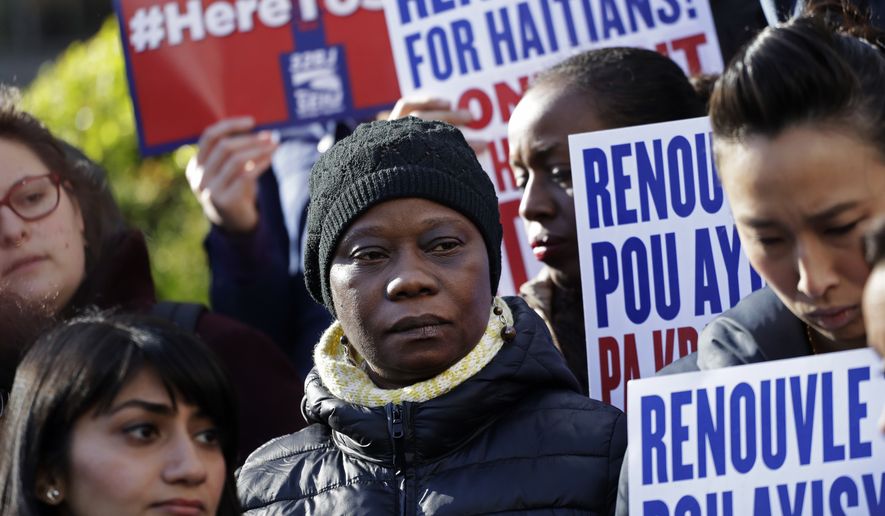 Immigration advocates rally in New York on Tuesday, Nov. 21, 2017, to protest the decision from the Department of Homeland Security to terminate Temporary Protected Status for people from Haiti. The Homeland Security Department said conditions in Haiti have improved significantly, so the benefit will be extended until July 2019 to give Haitians time to prepare to return home. (AP Photo/Mark Lennihan)