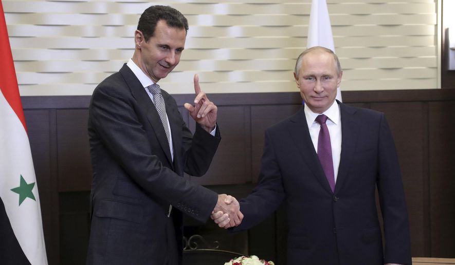 Russian President Vladimir Putin (right) met Monday with Syrian President Bashar Assad, who thanked him for &quot;saving Syria&quot; with the help of the Russian military. (Associated Press)