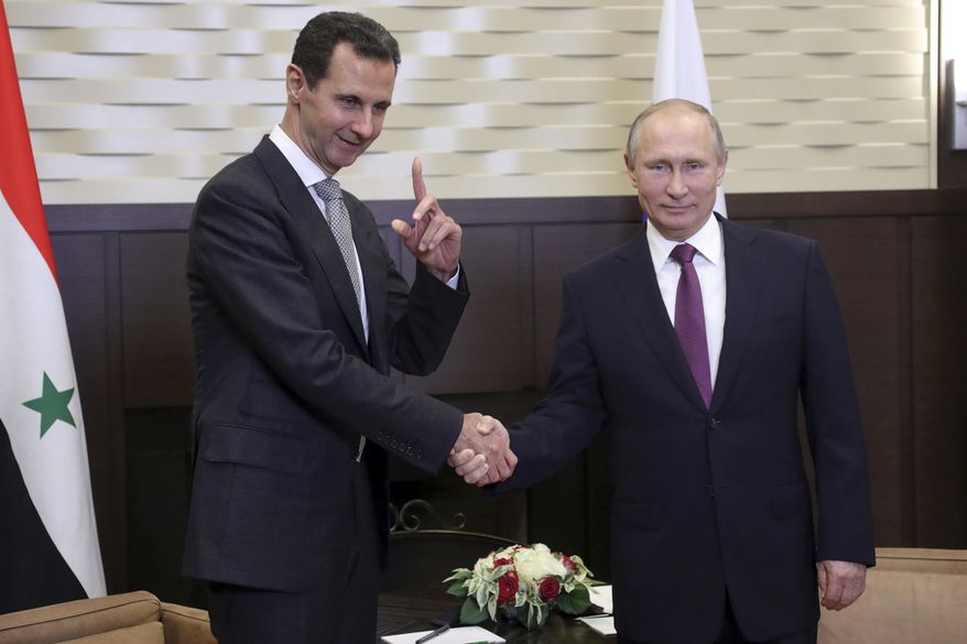 Russian President Vladimir Putin (right) met Monday with Syrian President Bashar Assad, who thanked him for &quot;saving Syria&quot; with the help of the Russian military. (Associated Press)