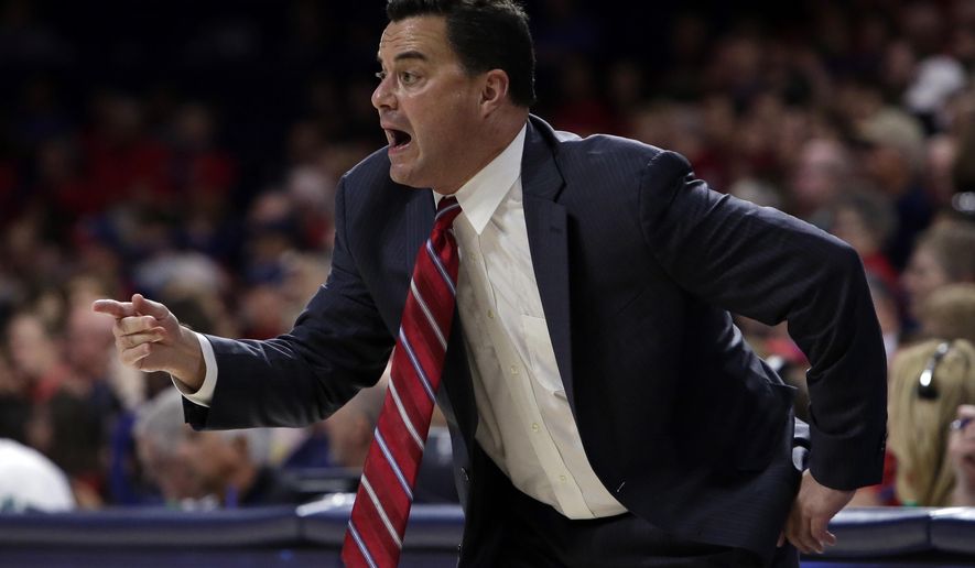 FILE - In this Nov. 10, 2017, file photo, Arizona head coach Sean Miller gestures in the first half during an NCAA college basketball game against Northern Arizona, in Tucson, Ariz.  Miller’s second-ranked Wildcats open play in the Battle 4 Atlantis tournament Wednesday against North Carolina State in the Bahamas. (AP Photo/Rick Scuteri, File)