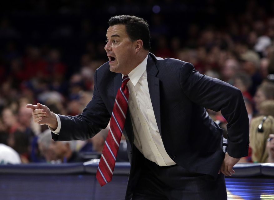 FILE - In this Nov. 10, 2017, file photo, Arizona head coach Sean Miller gestures in the first half during an NCAA college basketball game against Northern Arizona, in Tucson, Ariz.  Miller’s second-ranked Wildcats open play in the Battle 4 Atlantis tournament Wednesday against North Carolina State in the Bahamas. (AP Photo/Rick Scuteri, File)