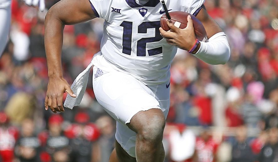 FILE - In this Nov. 18, 2017, file photo, TCU quarterback Shawn Robinson (12) runs down the field during the first half of an NCAA college football game against Texas Tech, in Lubbock, Texas. Shawn Robinson and Charlie Brewer played in the same NFL stadium on the same day just more than 11 months ago. They were in different championship games. The two Texas Class 6A high school state champion quarterbacks are now Big 12 freshmen, and going against each other in a regular-season finale. Brewer will start for Baylor, and Robinson is coming off his first start for No. 10 TCU. (AP Photo/Brad Tollefson, File)