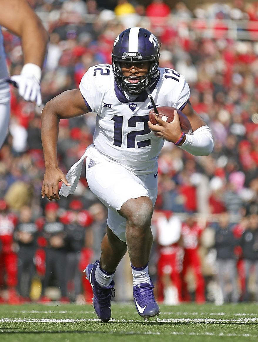 FILE - In this Nov. 18, 2017, file photo, TCU quarterback Shawn Robinson (12) runs down the field during the first half of an NCAA college football game against Texas Tech, in Lubbock, Texas. Shawn Robinson and Charlie Brewer played in the same NFL stadium on the same day just more than 11 months ago. They were in different championship games. The two Texas Class 6A high school state champion quarterbacks are now Big 12 freshmen, and going against each other in a regular-season finale. Brewer will start for Baylor, and Robinson is coming off his first start for No. 10 TCU. (AP Photo/Brad Tollefson, File)