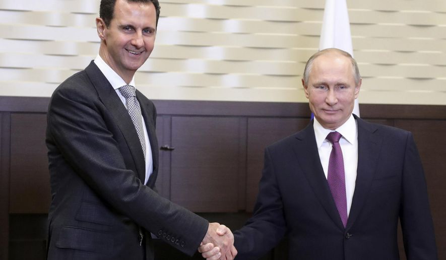 In this photo taken on Monday, Nov. 20, 2017, Russian President Vladimir Putin, right, shakes hand with Syrian President Bashar Assad in the Bocharov Ruchei residence in the Black Sea resort of Sochi, Russia. Russian state TV said the two leaders held bilateral talks on Monday and then met with Russian military chiefs. It was the second time Assad has traveled to Russia to meet with Putin in the course of the country&#x27;s six-year civil war.  (Mikhail Klimentyev, Kremlin Pool Photo via AP)