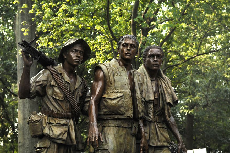 The &#39;Three Servicemen Statue&quot; stands near the Vietnam Veterans War Memorial in Washington, D.C. (Department of Defense photo)