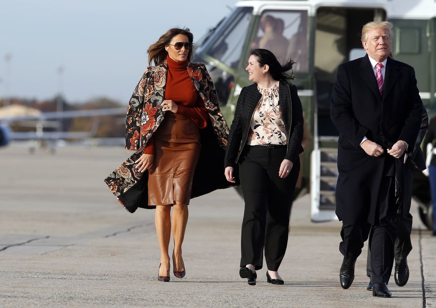 First lady Melania Trump, left, walks with President Donald Trump, as they board Air Force One, as they depart Tuesday, Nov. 21, 2017, at Andrews Air Force Base, Md. Trump is en route to his Mar-a-Largo resort in Florida for the Thanksgiving holiday. (AP Photo/Alex Brandon)