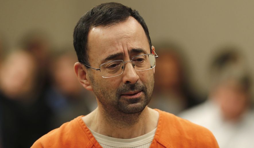Dr. Larry Nassar appears in court for a plea hearing in Lansing, Mich., Wednesday, Nov. 22, 2017. Nasser, a sports doctor accused of molesting girls while working for USA Gymnastics and Michigan State University, pleaded guilty to multiple charges of sexual assault and will face at least 25 years in prison. (AP Photo/Paul Sancya)