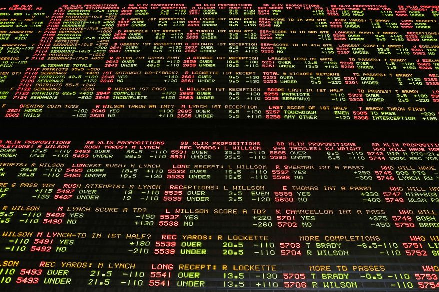 FILE – In this Jan. 27, 2015, file photo, Super Bowl proposition bets are displayed on a board at the Westgate Las Vegas SuperBook race and sports book in Las Vegas. The U.S. Supreme Court is set to hear arguments Dec. 4, 2017, as the state of New Jersey challenges a 1992 law forbidding state-authorized sports gambling in all but four states that met a 1991 deadline to legalize it: Delaware, Montana, Nevada and Oregon. (AP Photo/John Locher) ** FILE **