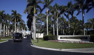 The motorcade of President Donald Trump arrives at at the Trump International Golf Club, Wednesday, Nov. 22, 2017, in West Palm Beach, Fla. (AP Photo/Alex Brandon)