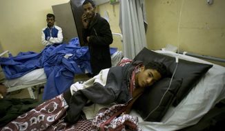 Abdallah Abdel Nasser, 14, receives medical treatment at Suez Canal University hospital in Ismailia, Egypt, Friday, Nov. 24, 2017, after he was in injured during an attack on a mosque. Militants attacked a crowded mosque during Friday prayers in the Sinai Peninsula, setting off explosives, spraying worshippers with gunfire and killing more than 200 people in the deadliest ever attack by Islamic extremists in Egypt. (AP Photo/Amr Nabil)